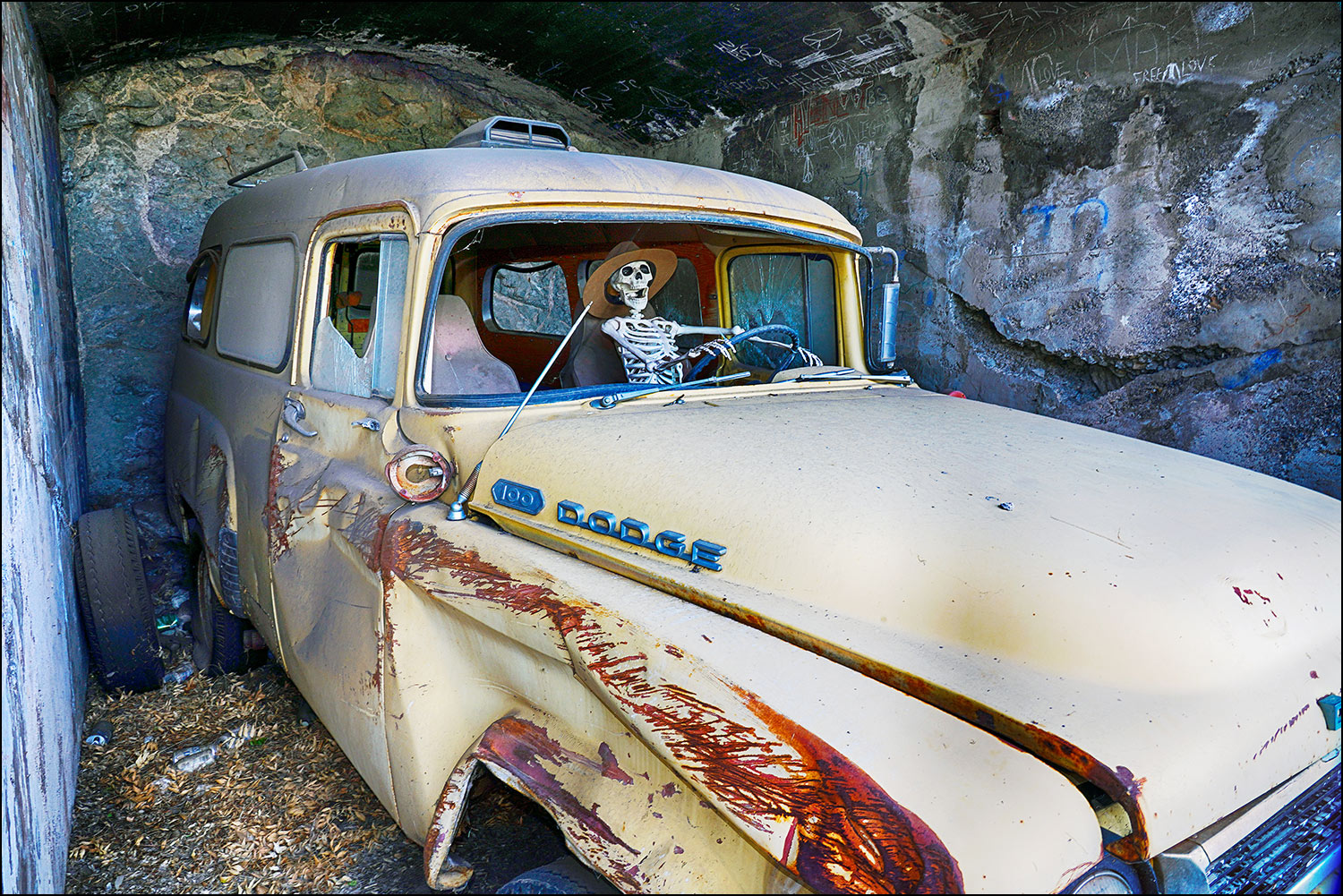 Dodge truck in cave with skeleton driver